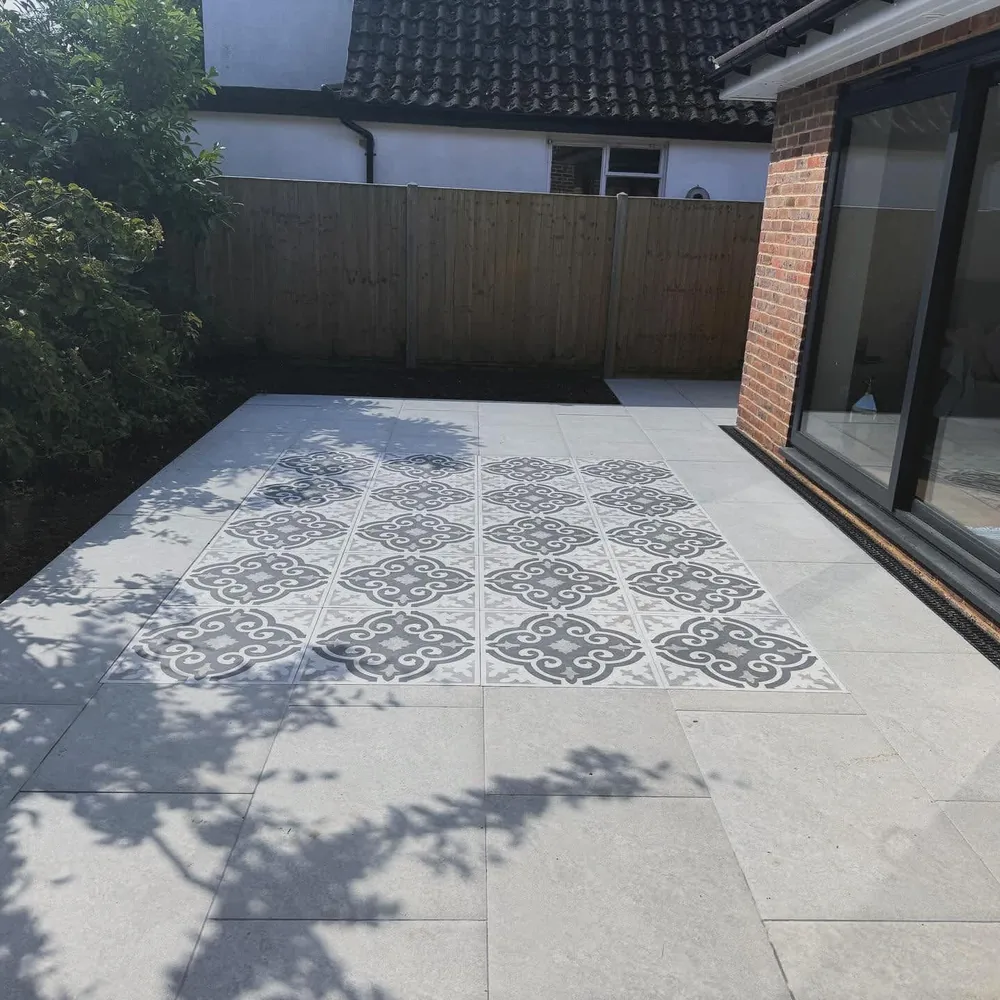 Porcelain patio with a patterned feature panel set into the centre