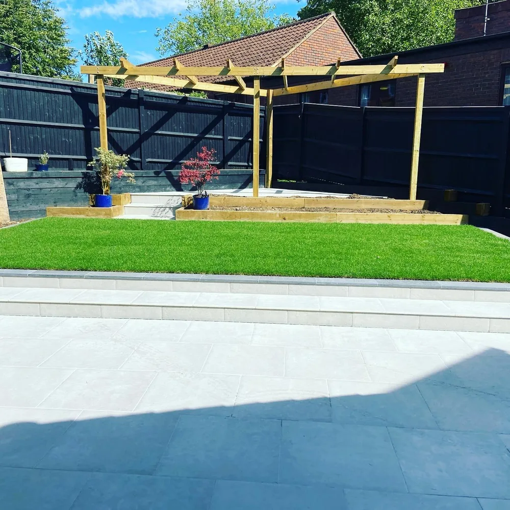 Timber pergola set at the head of an artificial lawn
